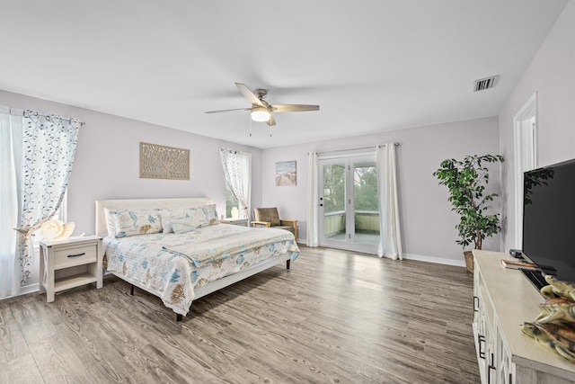 bedroom with access to outside, ceiling fan, and hardwood / wood-style flooring