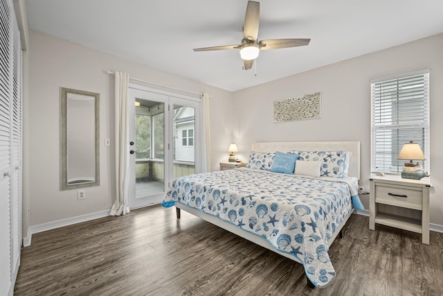 bedroom with a closet, access to outside, ceiling fan, and dark wood-type flooring