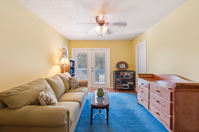 117 Spanish Oaks Ln, Saint Augustine Beach, FL 32080 - living area featuring ceiling fan, french doors, and a textured ceiling
