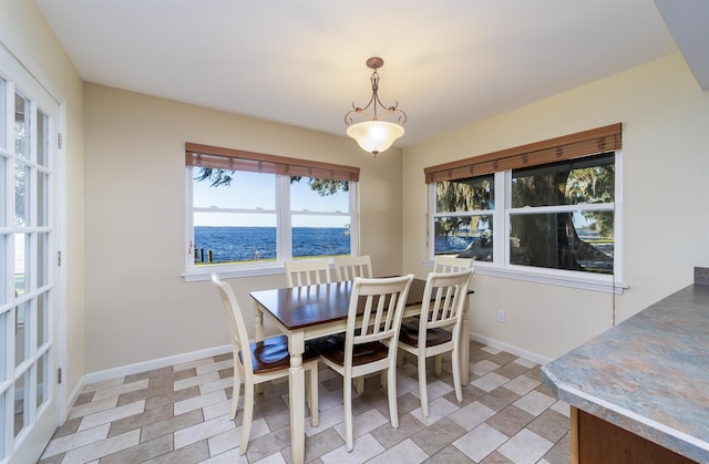 dining room with a water view