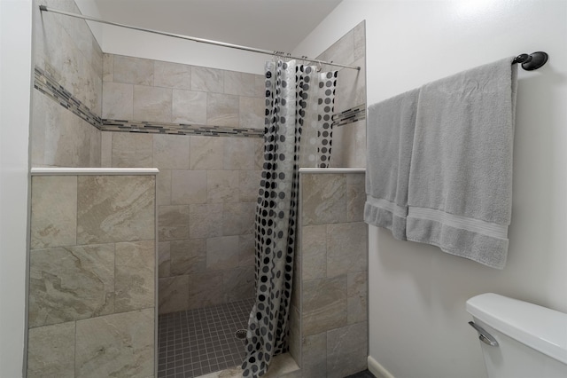 bathroom with toilet and walk in shower