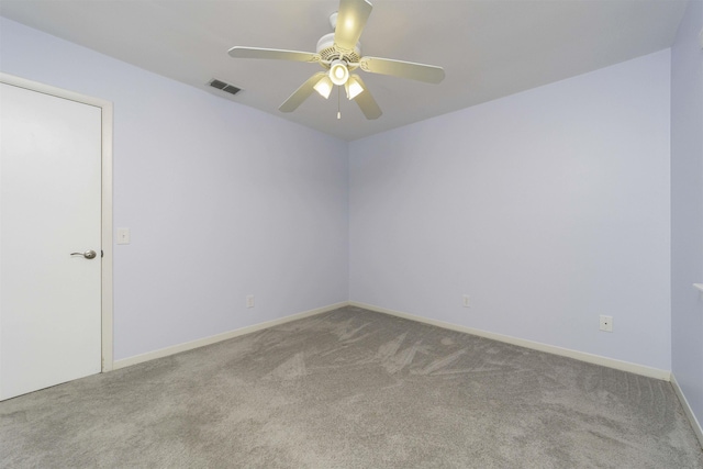 unfurnished room featuring ceiling fan and light colored carpet