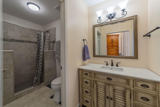 bathroom with vanity, toilet, and curtained shower