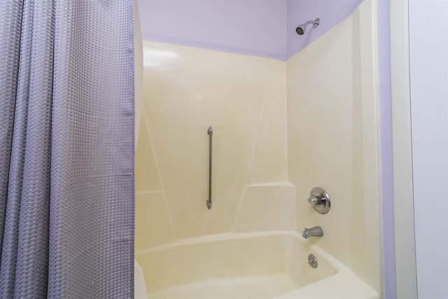 bathroom featuring shower / bathtub combination with curtain