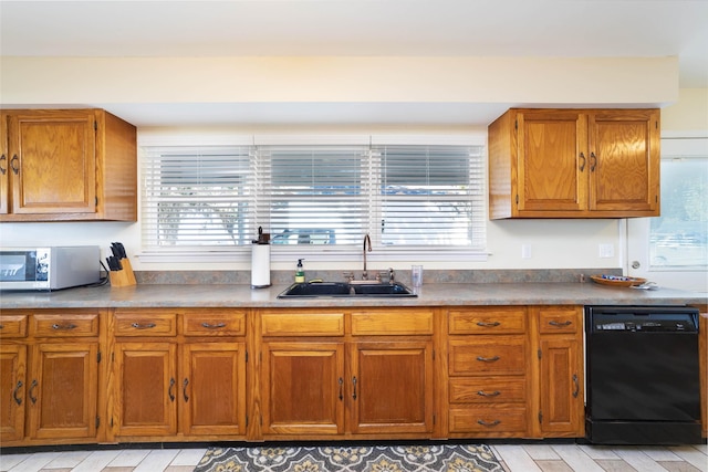 kitchen with dishwasher, a wealth of natural light, and sink