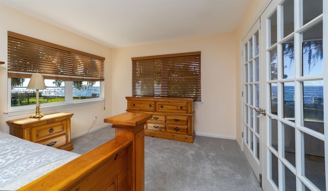 bedroom featuring light carpet