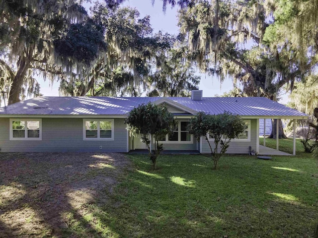 ranch-style house featuring a front lawn