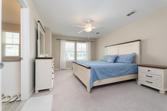 bedroom featuring light colored carpet and ceiling fan