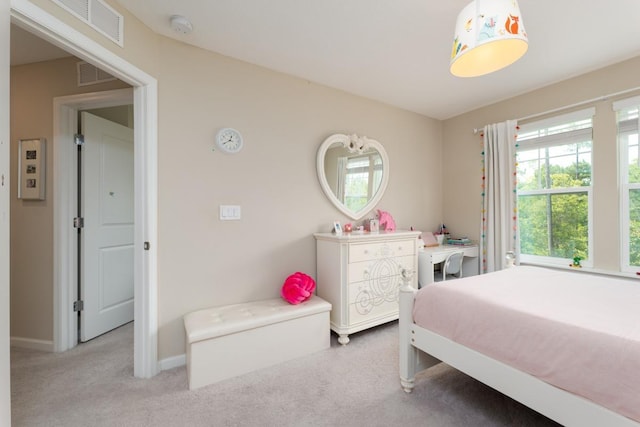 bedroom featuring light colored carpet