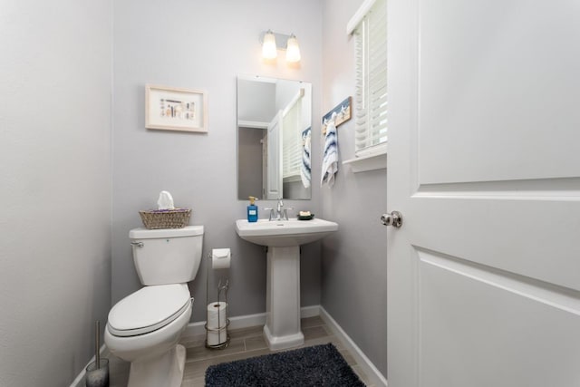 bathroom with toilet and sink