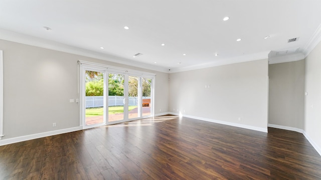 spare room with crown molding and dark hardwood / wood-style floors