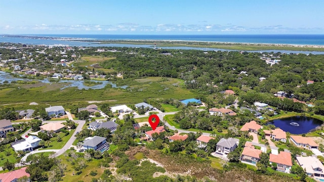 drone / aerial view with a water view