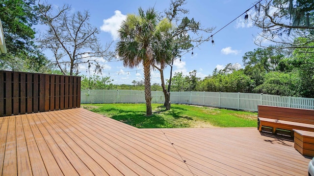 wooden terrace with a yard