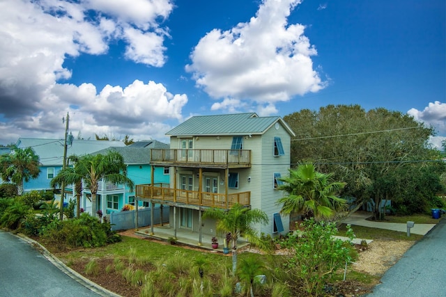 exterior space featuring a balcony and a patio area