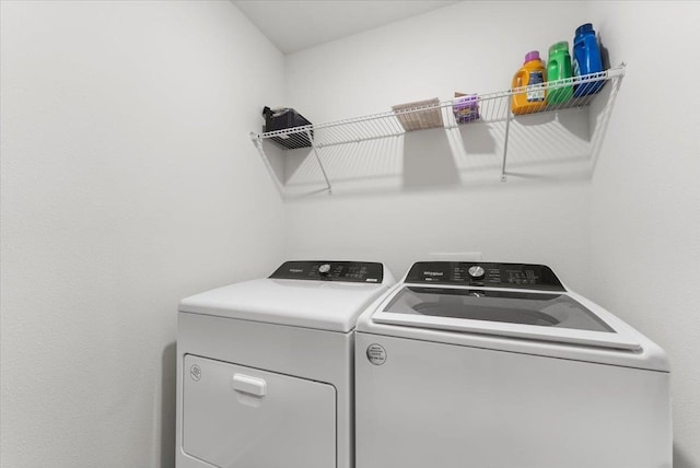 washroom with washing machine and dryer