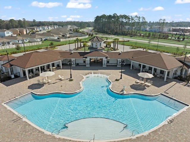 view of swimming pool featuring a patio area