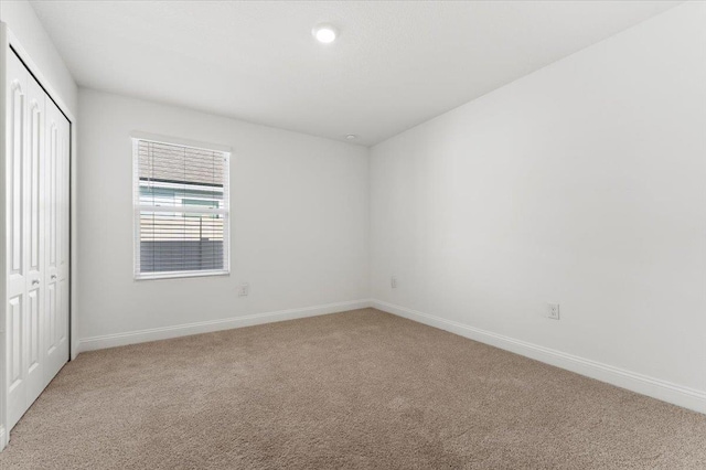 spare room featuring carpet flooring