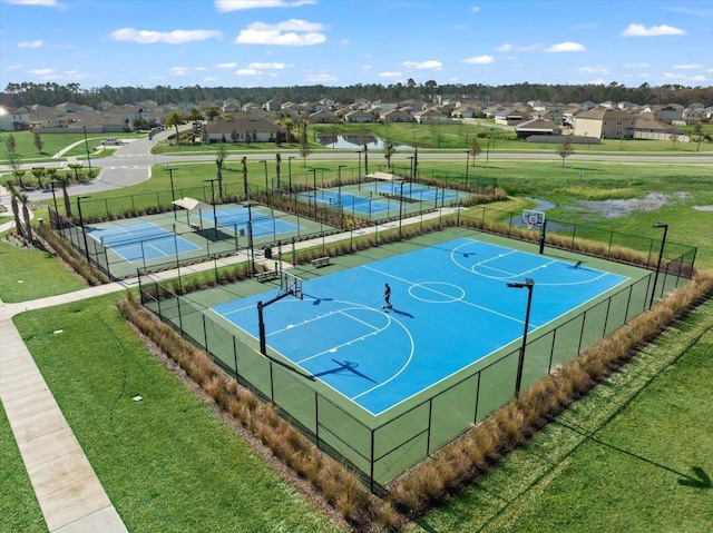 view of basketball court featuring a yard and tennis court