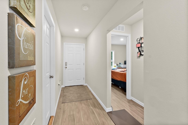 hallway featuring light hardwood / wood-style floors