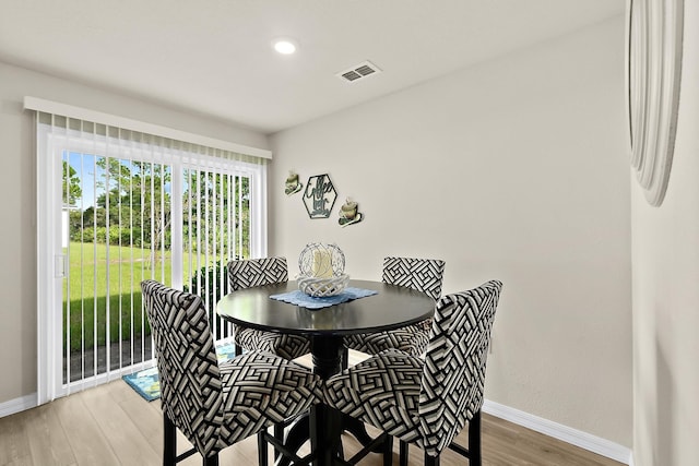 dining area with hardwood / wood-style flooring