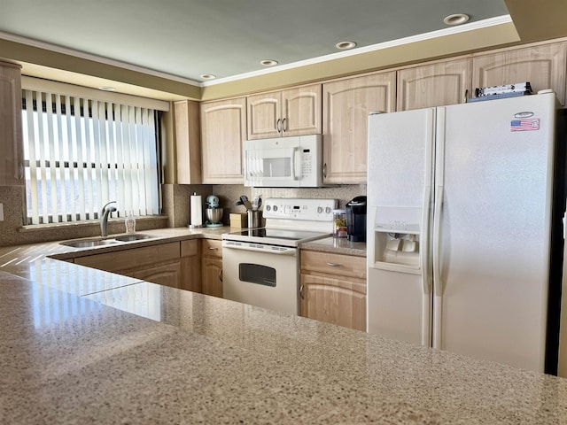 kitchen with light brown cabinets, white appliances, backsplash, and sink