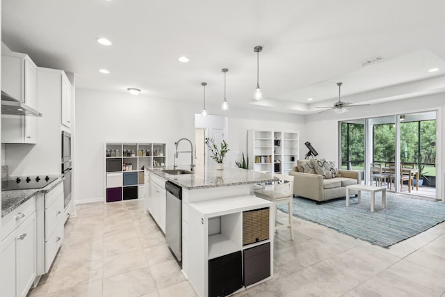 295 Deerfield Meadows Cir, Saint Augustine, FL 32086 - kitchen with stainless steel appliances, ceiling fan, recessed lighting, a breakfast bar, and white cabinets