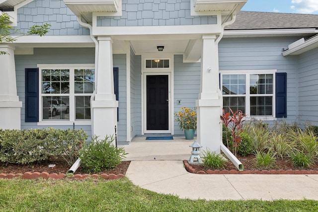 295 Deerfield Meadows Cir, Saint Augustine, FL 32086 - property entrance featuring a porch and a shingled roof