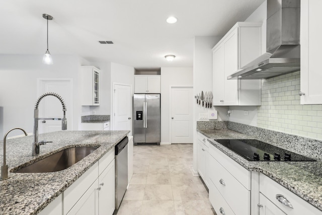 295 Deerfield Meadows Cir, Saint Augustine, FL 32086 - kitchen with stainless steel appliances, wall chimney exhaust hood, white cabinetry, and glass insert cabinets