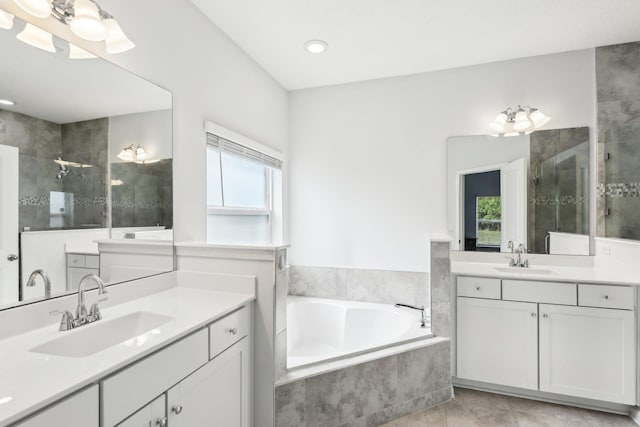 295 Deerfield Meadows Cir, Saint Augustine, FL 32086 - bathroom with tiled shower, two vanities, a bath, and recessed lighting