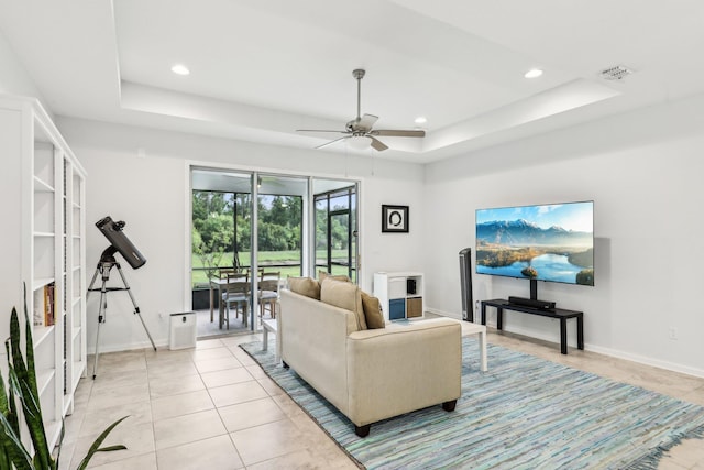 295 Deerfield Meadows Cir, Saint Augustine, FL 32086 - living room featuring a raised ceiling, ceiling fan, recessed lighting, and light tile patterned floors