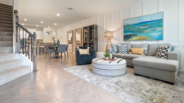 living room with light tile patterned floors