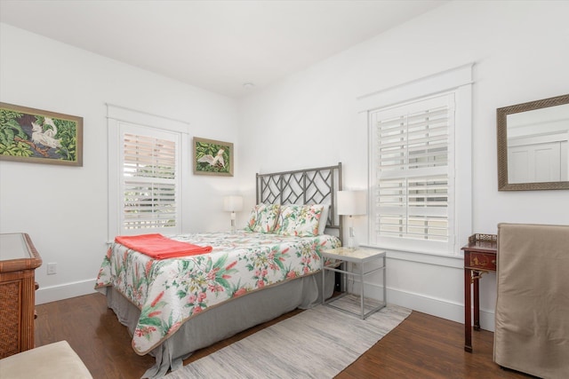 48 Osceola St, Saint Augustine, FL 32084 - bedroom with multiple windows, wood finished floors, and baseboards