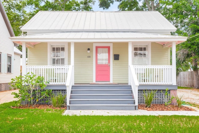 48 Osceola St, Saint Augustine, FL 32084 - bungalow-style home featuring covered porch, metal roof, and a standing seam roof