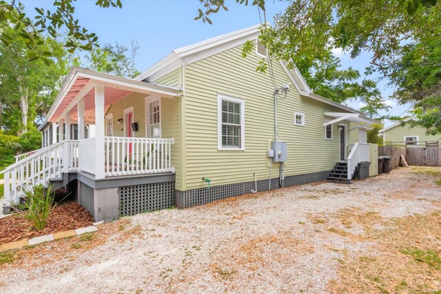 48 Osceola St, Saint Augustine, FL 32084 - view of side of property with a porch, fence, and crawl space