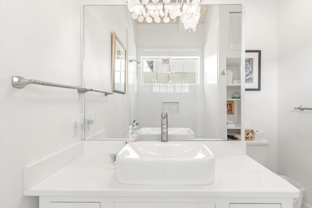 48 Osceola St, Saint Augustine, FL 32084 - bathroom with an inviting chandelier and vanity