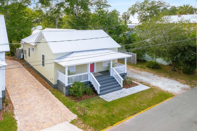 48 Osceola St, Saint Augustine, FL 32084 - bungalow with a porch and metal roof