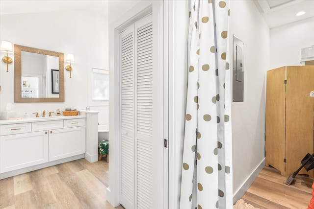 48 Osceola St, Saint Augustine, FL 32084 - bathroom with electric panel, a closet, wood finished floors, and vanity