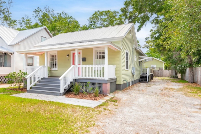 48 Osceola St, Saint Augustine, FL 32084 - bungalow featuring a porch, fence, crawl space, and driveway