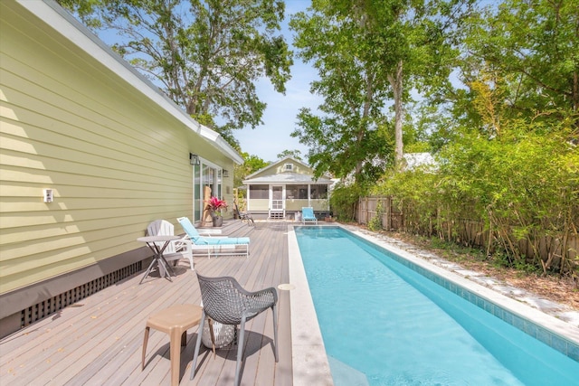 48 Osceola St, Saint Augustine, FL 32084 - view of pool with a wooden deck, a sunroom, a fenced in pool, and a fenced backyard