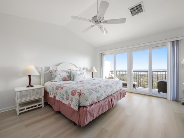 bedroom featuring access to exterior, ceiling fan, light hardwood / wood-style flooring, and vaulted ceiling