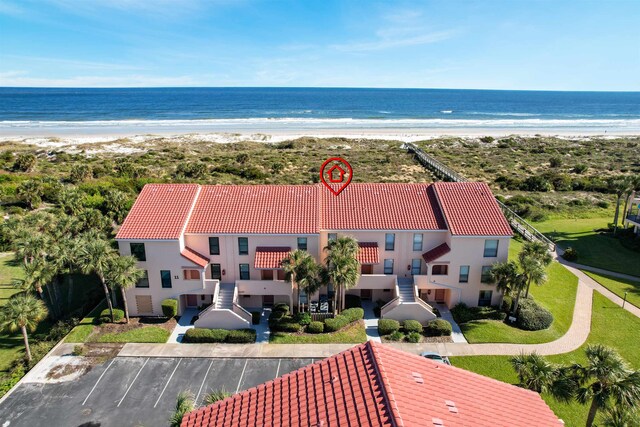 aerial view featuring a water view and a view of the beach