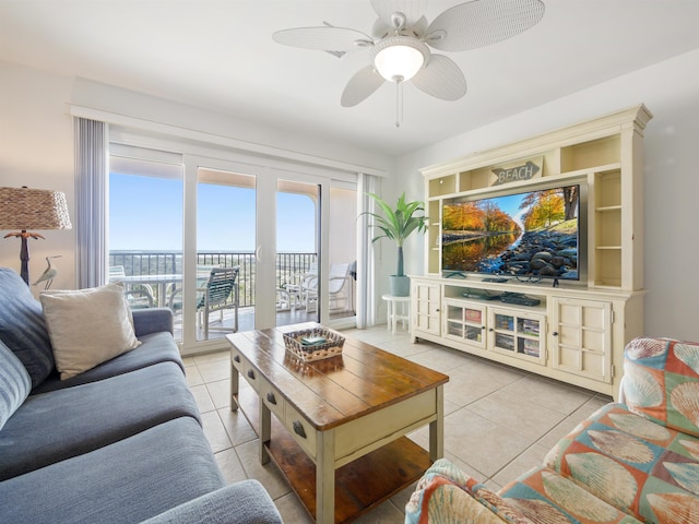 living room featuring ceiling fan and light tile patterned flooring