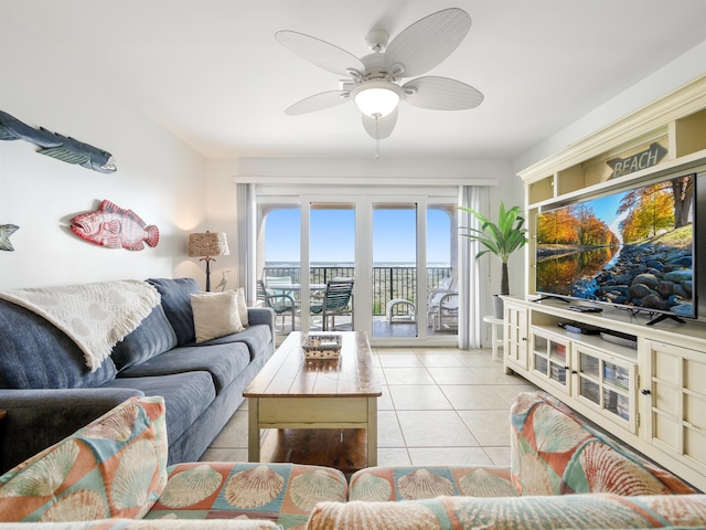 living room with ceiling fan and light tile patterned flooring