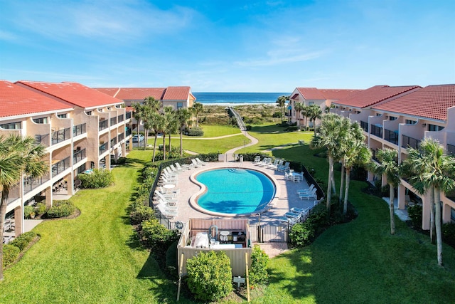 view of pool with a water view