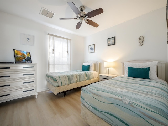 bedroom featuring ceiling fan and light wood-type flooring