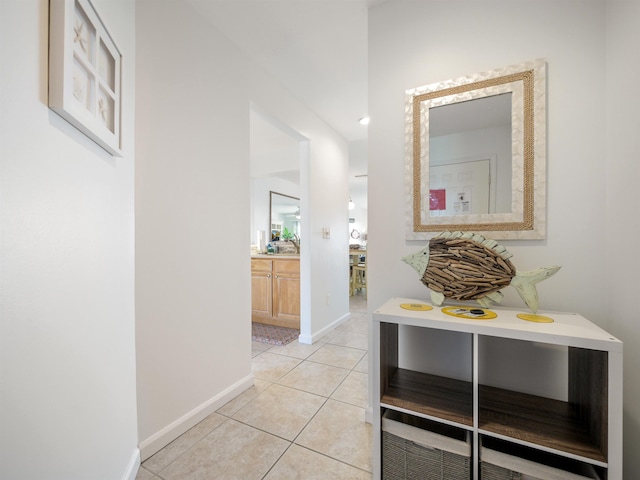 hall featuring light tile patterned flooring