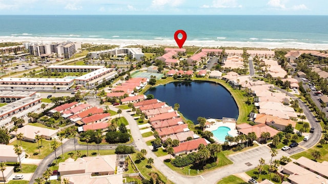 bird's eye view featuring a beach view and a water view