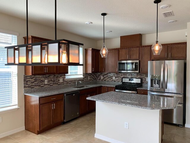 46 Curved Bay Trl, Ponte Vedra, FL 32081 - kitchen featuring visible vents, a wealth of natural light, a sink, and stainless steel appliances
