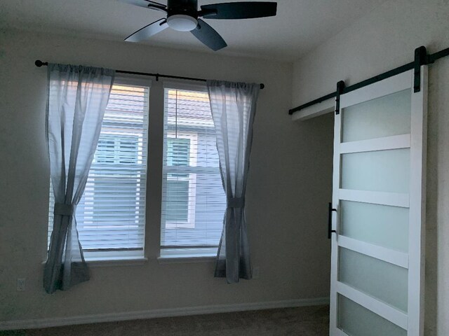 46 Curved Bay Trl, Ponte Vedra, FL 32081 - interior space with baseboards, a barn door, and ceiling fan
