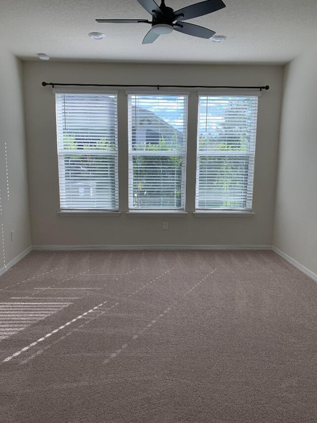 46 Curved Bay Trl, Ponte Vedra, FL 32081 - spare room with baseboards, ceiling fan, and carpet flooring